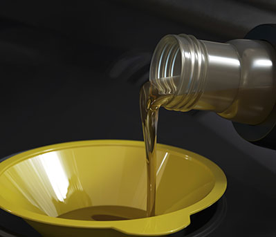 motor oil pouring into a funnel